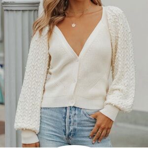 Elegant Cream Sweater with Textured Sleeves
